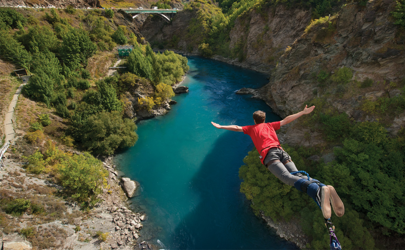 Bungy jumper leaping from Kawarau Bridge near Queenstown, one of the most popular things to do in Queenstown New Zealand