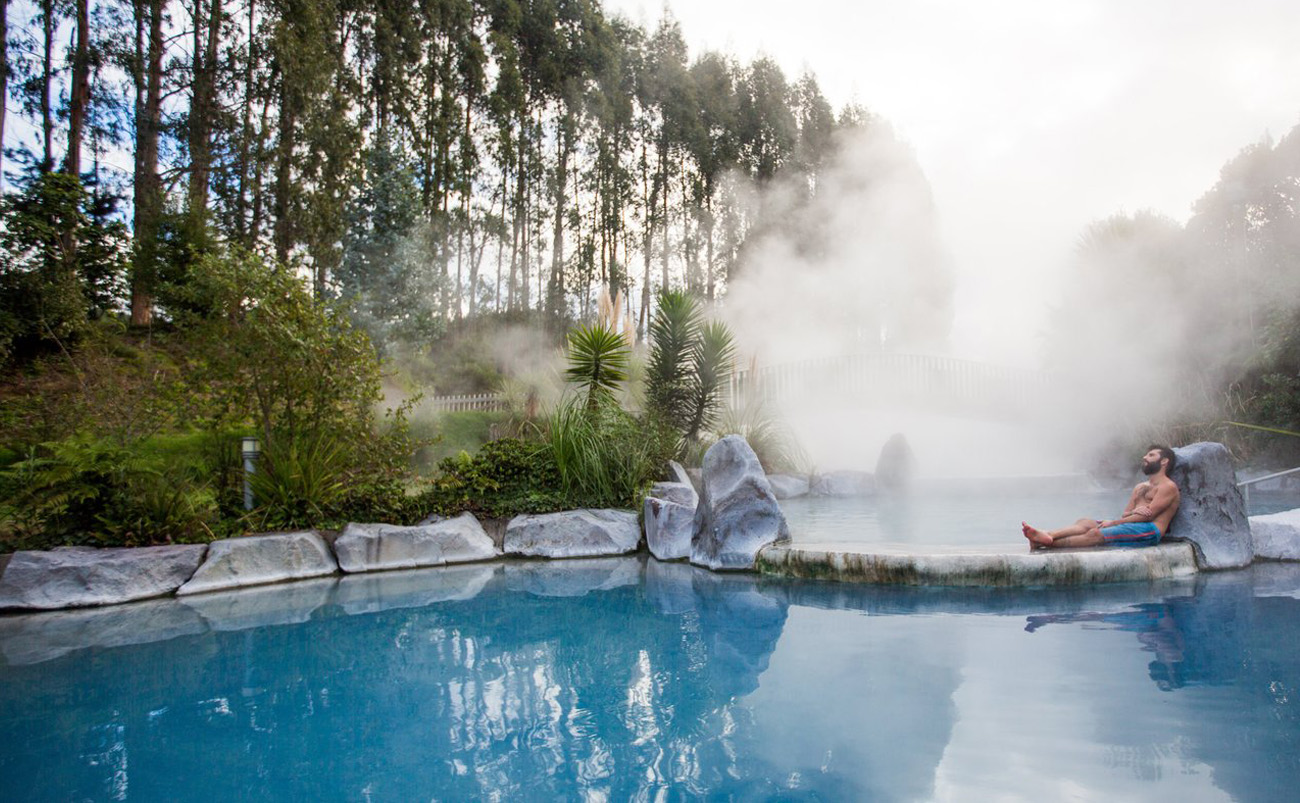 Visitors relaxing in naturally heated thermal pools near Taupō, New Zealand