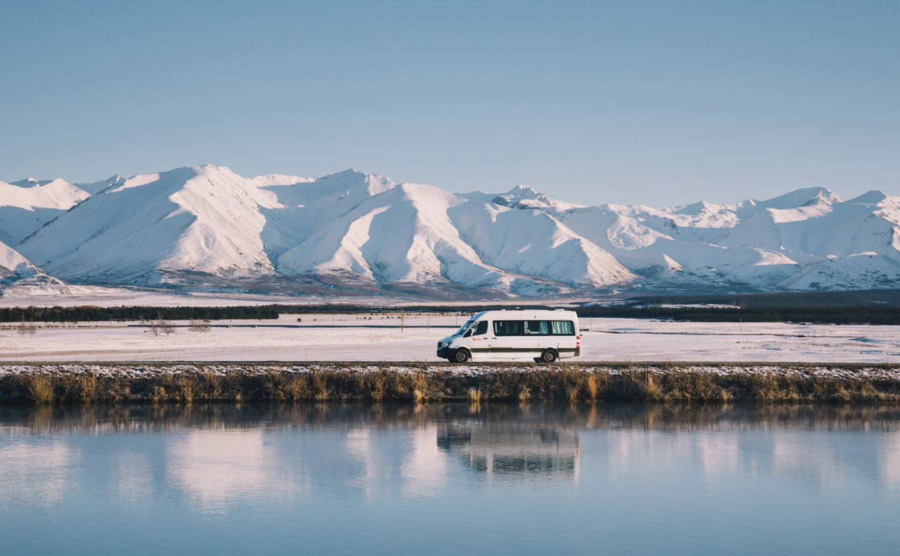 Motorhome travelling through the Mackenzie Country near Twizel during a New Zealand self-drive holiday